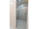 Modern shower with glass door and marble tile at 3888 E Weston Ln, San Tan Valley, AZ 85140