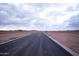 Unfinished street with beautiful mountain view, ready for new development at 3888 E Weston Ln, San Tan Valley, AZ 85140