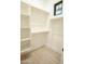 Functional walk-in closet with organized shelving, hanging rods, and a window at 3888 E Weston Ln, San Tan Valley, AZ 85140