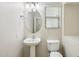 Clean bathroom with pedestal sink and toilet at 1967 W Busoni Pl, Phoenix, AZ 85023