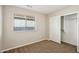 Bright bedroom with neutral walls and carpet flooring at 1967 W Busoni Pl, Phoenix, AZ 85023