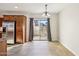 Dining area with tile floor, patio access and chandelier at 1967 W Busoni Pl, Phoenix, AZ 85023