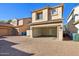 Attached garage with paved driveway and private courtyard at 1967 W Busoni Pl, Phoenix, AZ 85023