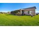 Backyard view showcasing a covered patio and lush greenery at 28308 N 157Th Pl, Scottsdale, AZ 85262