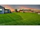 Large backyard with grassy area and partial house view at 28308 N 157Th Pl, Scottsdale, AZ 85262