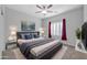 Spacious bedroom with gray platform bed and red curtains at 28308 N 157Th Pl, Scottsdale, AZ 85262