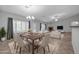 Dining area with a view of the living room and fireplace at 28308 N 157Th Pl, Scottsdale, AZ 85262