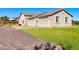 Home's exterior, highlighting a two-car garage and driveway at 28308 N 157Th Pl, Scottsdale, AZ 85262