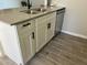 Kitchen island with double sink, dishwasher, and white shaker cabinets at 311 W Pontiac Dr # 8, Phoenix, AZ 85027