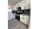 Modern kitchen with white shaker cabinets, stainless steel appliances, and gray countertops at 311 W Pontiac Dr # 8, Phoenix, AZ 85027