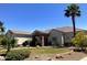 Inviting single-story home featuring a well-maintained lawn and desert landscaping at 18029 W San Miguel Ave, Litchfield Park, AZ 85340