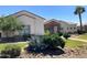 Charming single-story home showcases lush, drought-resistant landscaping at 18029 W San Miguel Ave, Litchfield Park, AZ 85340