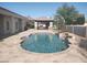 Backyard pool and outdoor kitchen area perfect for entertaining at 18029 W San Miguel Ave, Litchfield Park, AZ 85340