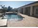 Beautiful backyard pool featuring a tanning ledge and water fountains at 18029 W San Miguel Ave, Litchfield Park, AZ 85340