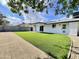 Backyard with new synthetic grass and covered patio at 2213 E Janice Way, Phoenix, AZ 85022