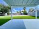 Relaxing backyard with synthetic grass and covered patio at 2213 E Janice Way, Phoenix, AZ 85022