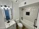 Modern bathroom with white vanity, updated fixtures, and geometric tile shower at 2213 E Janice Way, Phoenix, AZ 85022