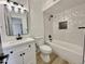 Stylish bathroom with white vanity, modern fixtures, and a tiled shower-tub combo at 2213 E Janice Way, Phoenix, AZ 85022
