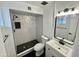 Updated bathroom featuring a walk-in shower with geometric tile and black accents at 2213 E Janice Way, Phoenix, AZ 85022