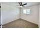 Cozy bedroom with neutral carpet, a ceiling fan, and ample natural light at 2213 E Janice Way, Phoenix, AZ 85022