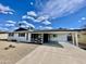Charming single-story home featuring a covered carport and low-maintenance desert landscaping at 2213 E Janice Way, Phoenix, AZ 85022