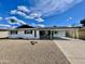 Charming single-story home featuring a covered carport and low-maintenance desert landscaping at 2213 E Janice Way, Phoenix, AZ 85022