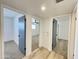 Hallway view showcasing access to multiple rooms and built-in storage at 2213 E Janice Way, Phoenix, AZ 85022