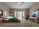 Bright main bedroom featuring a sliding glass door to the backyard at 2237 N Calle Largo --, Mesa, AZ 85207