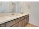 Double sink bathroom vanity with gray wood cabinetry and bright countertop at 28958 N 174Th Ln, Surprise, AZ 85387