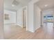 Bright hallway with wood-look tile flooring leads to various rooms in this home at 28958 N 174Th Ln, Surprise, AZ 85387