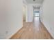 Bright hallway with wood-style tile flooring connecting multiple rooms at 28958 N 174Th Ln, Surprise, AZ 85387