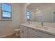 Bathroom with double vanity, mirror and tile flooring at 28976 N 174Th Ln, Surprise, AZ 85387