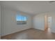 Bedroom with wood-look tile flooring and window at 28976 N 174Th Ln, Surprise, AZ 85387