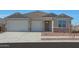 New single-story home with two-car garage and desert landscaping at 28976 N 174Th Ln, Surprise, AZ 85387