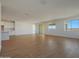 Bright and airy living room with wood-look tile floors and sliding glass door at 28976 N 174Th Ln, Surprise, AZ 85387