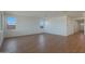 Bright and airy living room with wood-look tile floors and sliding glass door at 28976 N 174Th Ln, Surprise, AZ 85387