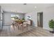 Elegant dining area with hardwood floors and sliding door access to patio at 12502 W Limewood Dr, Sun City West, AZ 85375