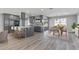 Modern kitchen featuring gray cabinets, island, and stainless steel appliances at 12502 W Limewood Dr, Sun City West, AZ 85375