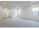 Large bedroom with multiple windows and walk in closet at 17643 W Middlebury St, Surprise, AZ 85388