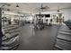 Spacious fitness center with a variety of exercise machines and free weights catering to diverse fitness needs at 17643 W Middlebury St, Surprise, AZ 85388