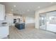 Open kitchen and living area, featuring a blue kitchen island at 17643 W Middlebury St, Surprise, AZ 85388