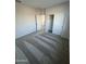 Spacious bedroom with gray carpet and double-door closet at 2593 E Bluff Spring Ave, Apache Junction, AZ 85119