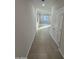 Hallway with tile floors leading to living areas at 2593 E Bluff Spring Ave, Apache Junction, AZ 85119