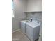 Laundry room with washer, dryer, and overhead shelving at 2593 E Bluff Spring Ave, Apache Junction, AZ 85119