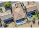 This aerial view shows the house with a pristine pool, and backyard with mature landscaping at 3414 E Virgil Dr, Gilbert, AZ 85298