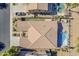 An aerial view shows the house with a pristine pool, and backyard with mature landscaping at 3414 E Virgil Dr, Gilbert, AZ 85298