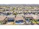 Bird's eye view of the neighborhood featuring neatly arranged homes, lush green lawns, and community amenities at 3414 E Virgil Dr, Gilbert, AZ 85298