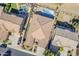 This aerial view shows the house with a pristine pool, and backyard with mature landscaping at 3414 E Virgil Dr, Gilbert, AZ 85298