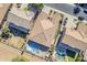 This aerial view shows the house with a pristine pool, and backyard with mature landscaping at 3414 E Virgil Dr, Gilbert, AZ 85298
