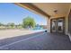 Covered patio overlooks luxurious pool and lush backyard at 3414 E Virgil Dr, Gilbert, AZ 85298